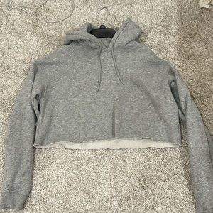 URBAN OUTFITTERS OUT FROM UNDER CROPPED HOODIE.